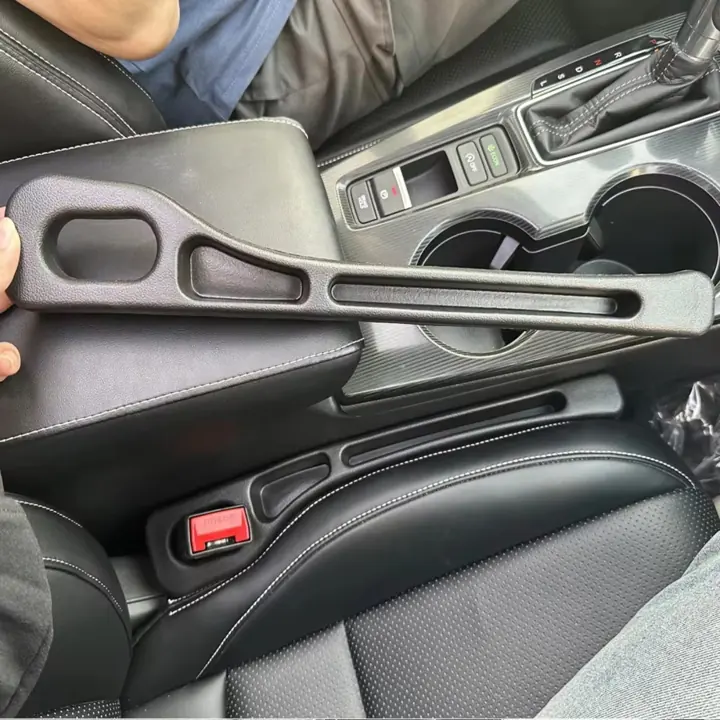 Gap filler fitted next to the seatbelt buckle