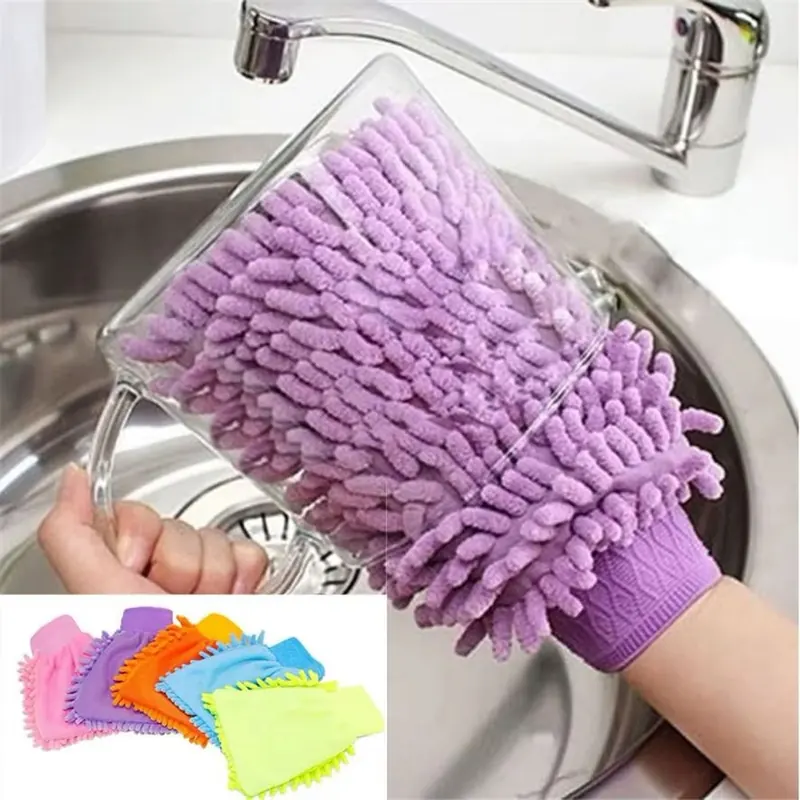 Glove cleaning a glass cup in the kitchen sink